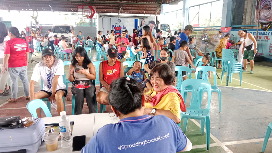 SM Foundation's resident doctor conducts a consultation, ensuring patients receive thorough examinations and education on preventive health measures.